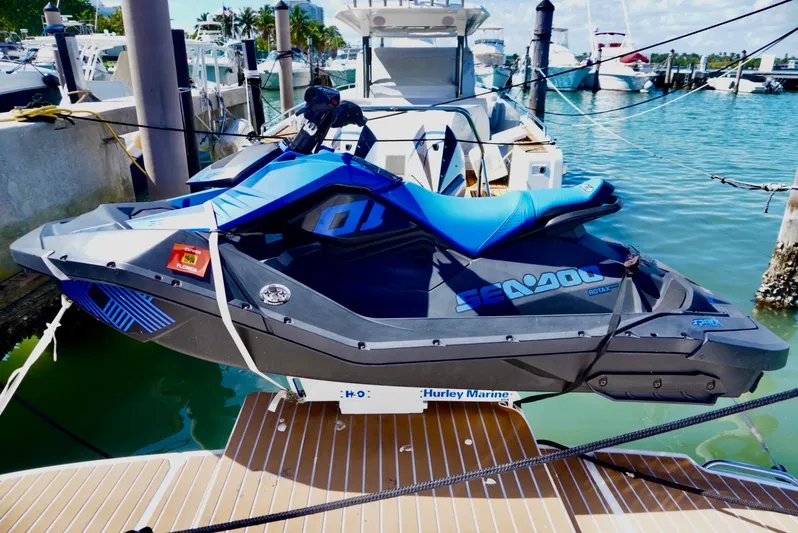  Yacht Photos Pics Jet ski docked on a 2007 Sea Ray 38 Sundancer, marina background.