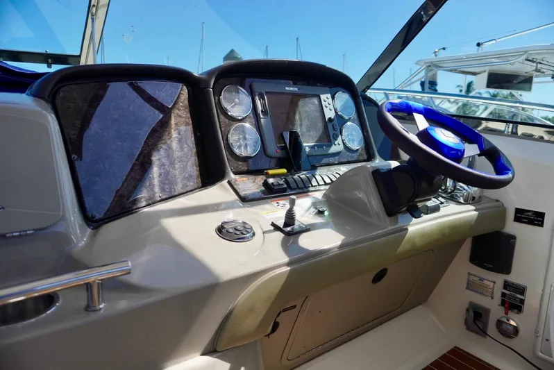  Yacht Photos Pics 2007 Sea Ray 38 Sundancer helm with gauges, steering wheel, and navigation controls.