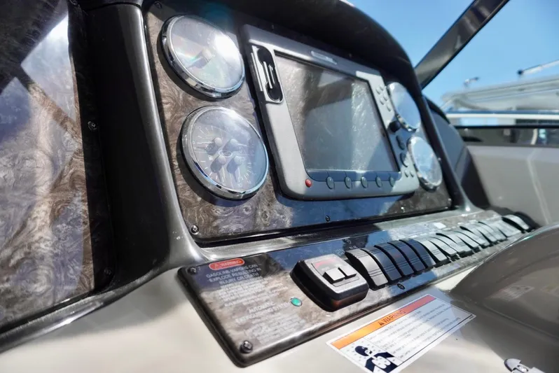  Yacht Photos Pics Control panel of 2007 Sea Ray 38 Sundancer boat with gauges and navigation screen.