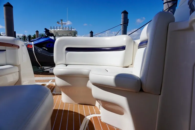 Yacht Photos Pics 2007 Sea Ray 38 Sundancer interior with white seating and wooden flooring.