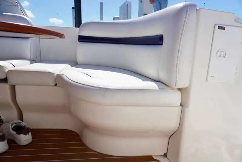  Yacht Photos Pics 2007 Sea Ray 38 Sundancer interior seating with white upholstery and wooden flooring.