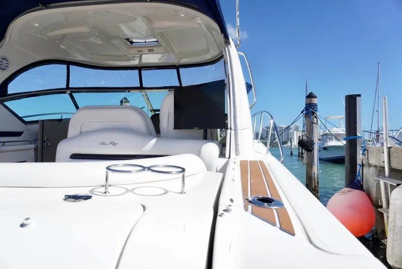  Yacht Photos Pics 2007 Sea Ray 38 Sundancer yacht docked at marina, sunny day, clear blue sky.