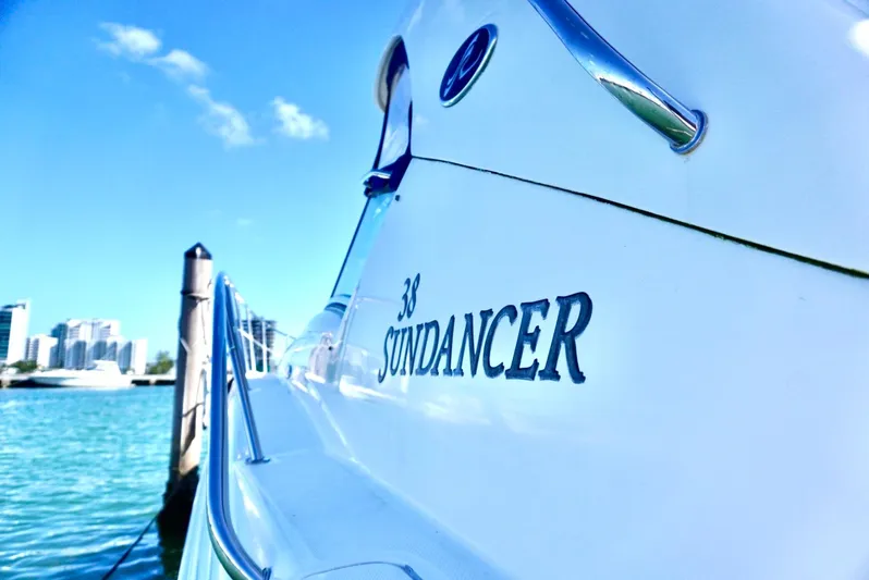  Yacht Photos Pics Sea Ray 38 Sundancer 2007 yacht docked with city skyline in background.