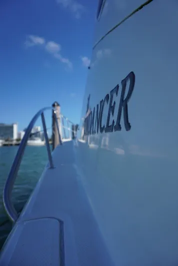  Yacht Photos Pics 2007 Sea Ray 38 Sundancer yacht side view with clear blue sky.