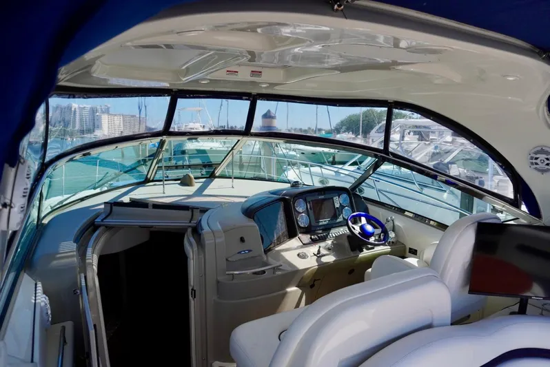  Yacht Photos Pics Interior view of 2007 Sea Ray 38 Sundancer yacht cockpit with modern controls.