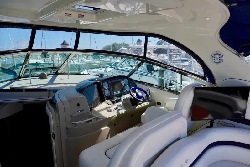  Yacht Photos Pics Interior view of 2007 Sea Ray 38 Sundancer yacht cockpit with modern controls and seating.