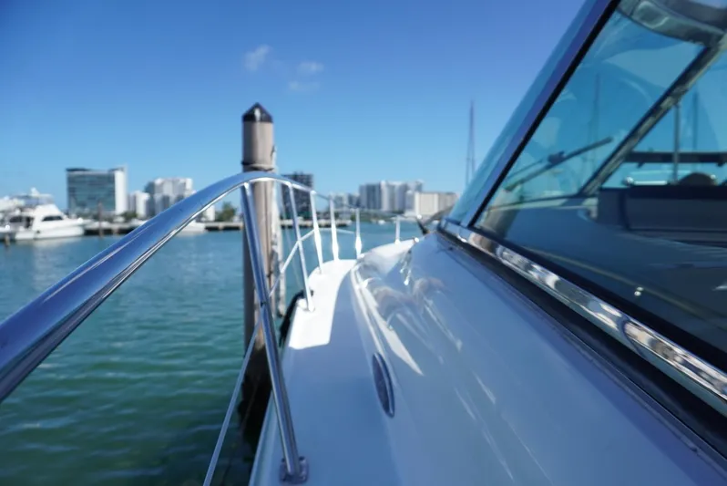  Yacht Photos Pics 2007 Sea Ray 38 Sundancer yacht docked in a marina with city skyline.