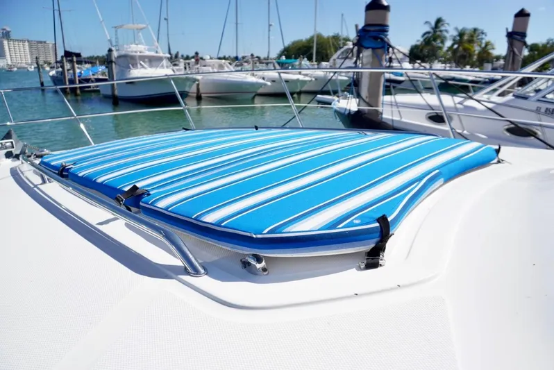  Yacht Photos Pics 2007 Sea Ray 38 Sundancer with blue striped sun pad on deck.