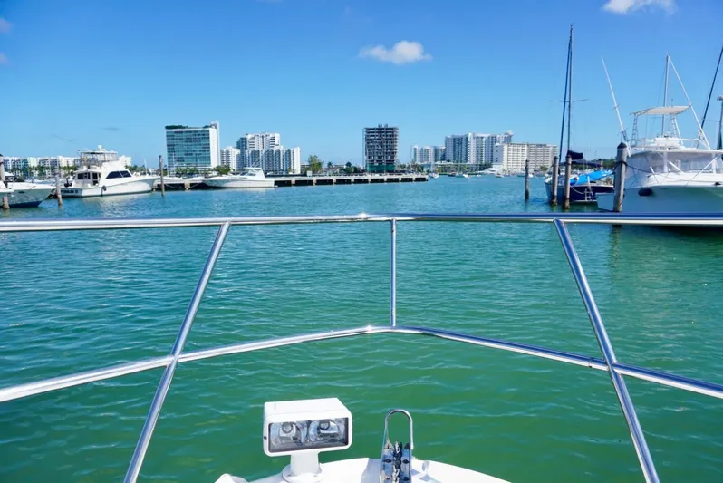  Yacht Photos Pics View from 2007 Sea Ray 38 Sundancer, overlooking marina and city skyline under clear blue sky.