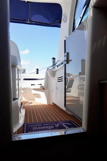  Yacht Photos Pics 2007 Sea Ray 38 Sundancer yacht interior with wooden flooring and outdoor view.