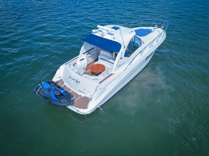  Yacht Photos Pics 2007 Sea Ray 38 Sundancer yacht on open water, featuring a sleek design and spacious deck.