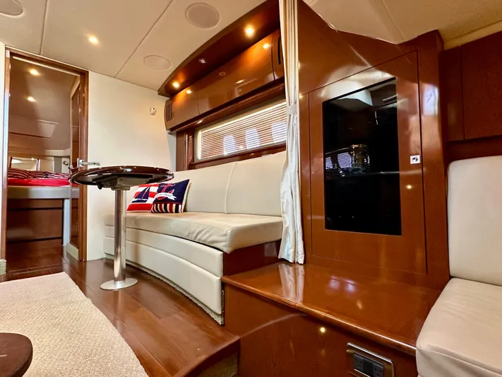  Yacht Photos Pics Luxurious interior of 2007 Sea Ray 38 Sundancer yacht with elegant seating and wood finishes.