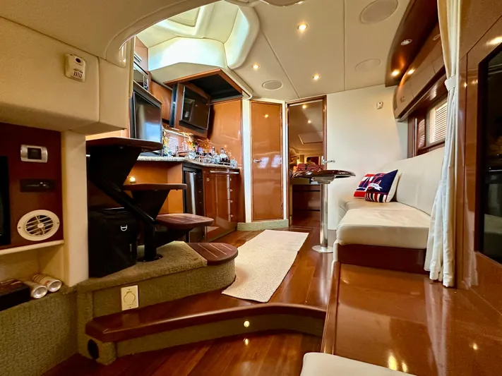  Yacht Photos Pics Luxurious interior of 2007 Sea Ray 38 Sundancer yacht with modern kitchen and seating area.