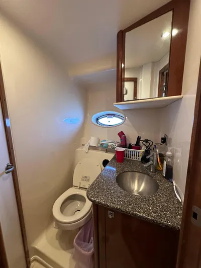  Yacht Photos Pics Bathroom interior of 2007 Sea Ray 38 Sundancer yacht with sink and toilet.