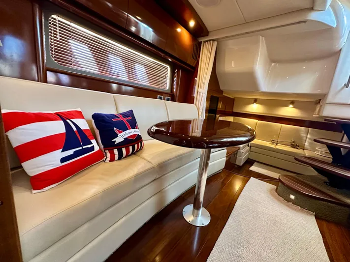  Yacht Photos Pics Interior of 2007 Sea Ray 38 Sundancer yacht with elegant seating and nautical-themed pillows.
