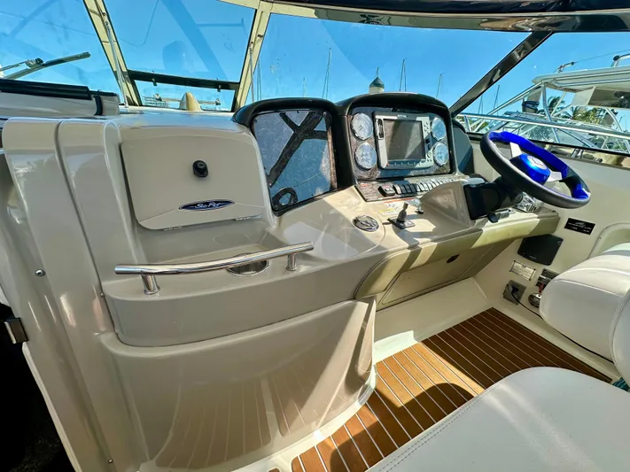  Yacht Photos Pics 2007 Sea Ray 38 Sundancer helm with modern controls and wood accents.