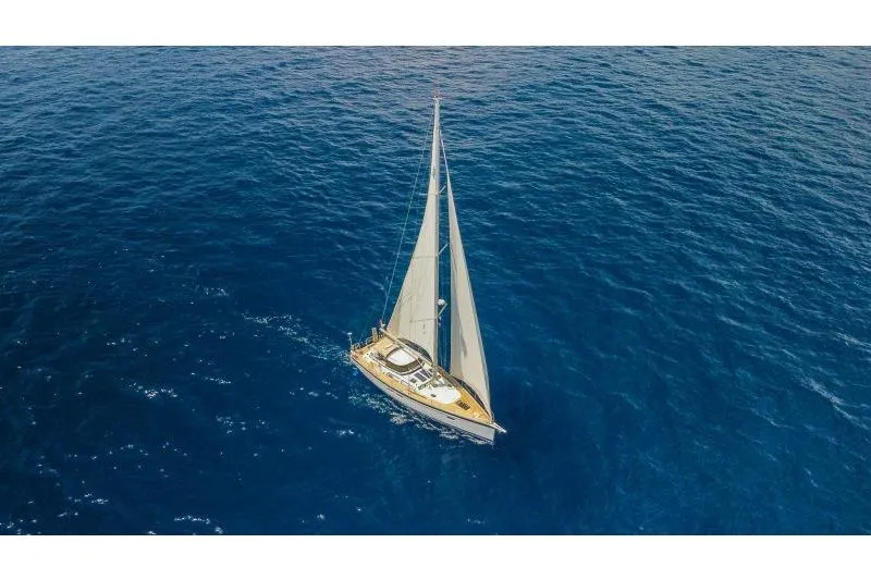  Yacht Photos Pics 2023 Hallberg-Rassy 50 sailing yacht on open blue sea.