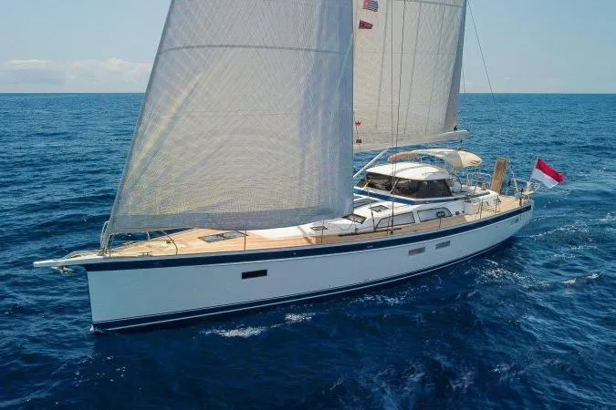  Yacht Photos Pics 2023 Hallberg-Rassy 50 sailing yacht on open sea, elegant design, white sails.
