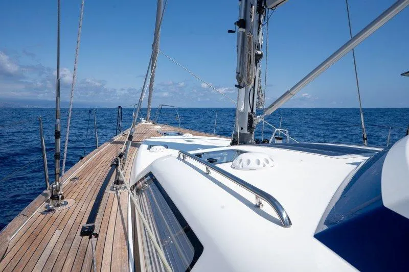  Yacht Photos Pics 2023 Hallberg-Rassy 50 yacht deck with ocean view and clear blue sky.