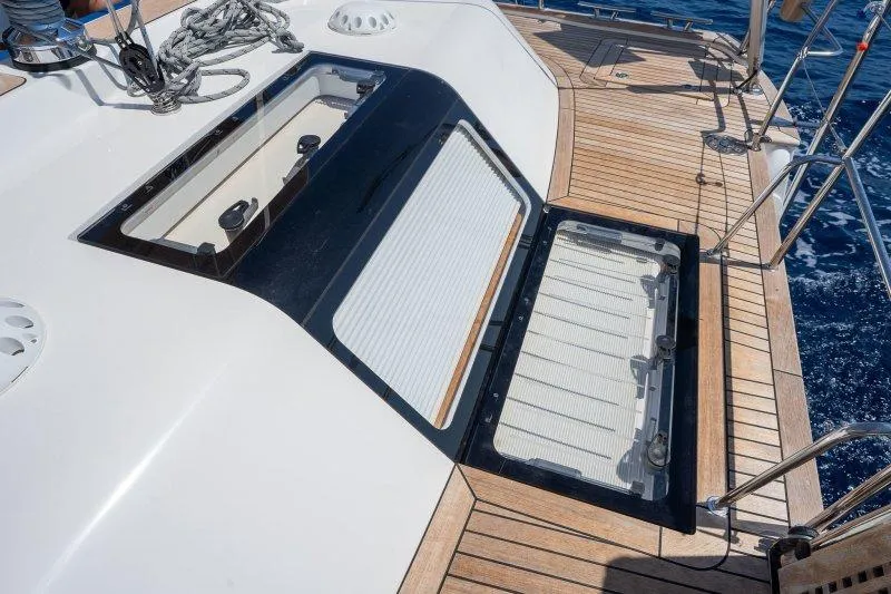  Yacht Photos Pics 2023 Hallberg-Rassy 50 yacht deck with open hatches and teak flooring.