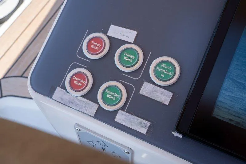  Yacht Photos Pics Control panel on 2023 Hallberg-Rassy 50 yacht with labeled winch buttons.
