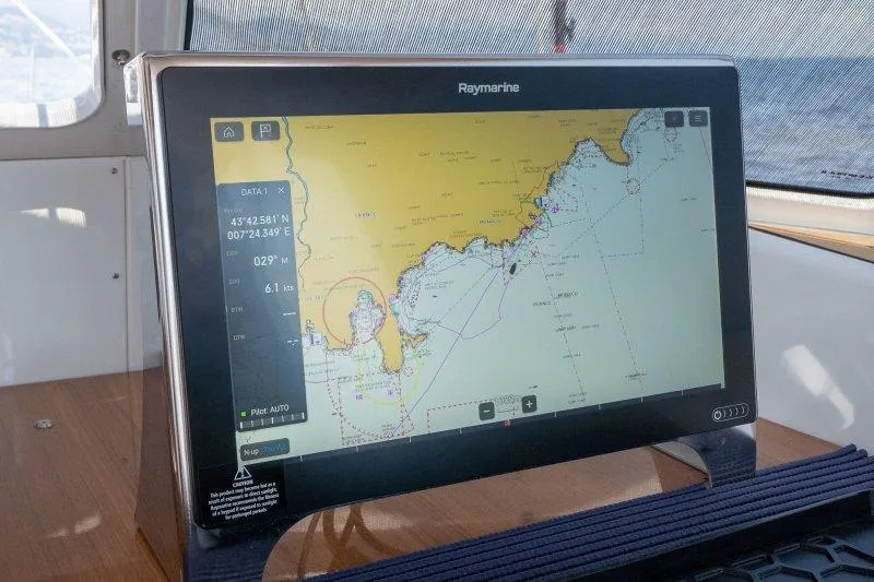  Yacht Photos Pics Navigation display on 2023 Hallberg-Rassy 50 yacht, showing detailed marine chart.