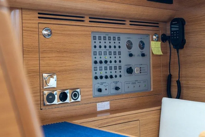  Yacht Photos Pics Control panel of 2023 Hallberg-Rassy 50 yacht, featuring navigation and communication equipment.