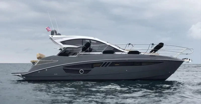  Yacht Photos Pics 2025 Cobrey 33 HT yacht on open water under cloudy sky.