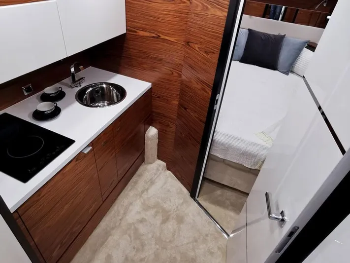  Yacht Photos Pics Modern kitchen and bedroom interior of 2025 Cobrey 33 HT yacht.