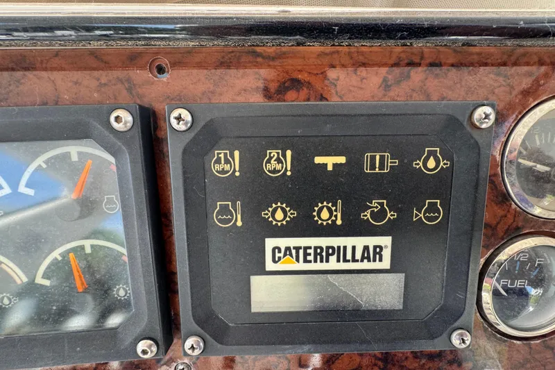Scanner II Yacht Photos Pics 1998 Sea Ray 480 Sedan Bridge dashboard with Caterpillar engine indicators and gauges.