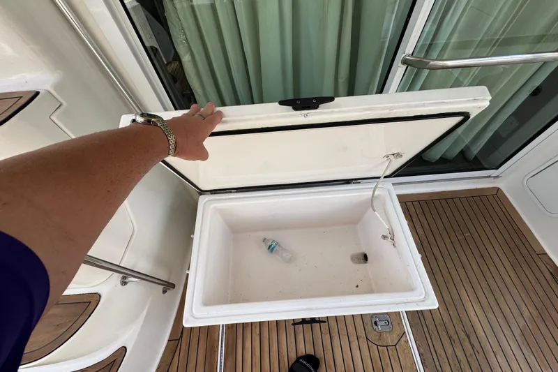 Scanner II Yacht Photos Pics Open storage compartment on 1998 Sea Ray 480 Sedan Bridge yacht deck.