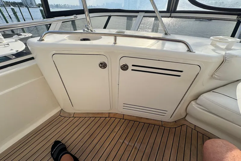 Scanner II Yacht Photos Pics Interior view of a 1998 Sea Ray 480 Sedan Bridge yacht with wooden flooring.