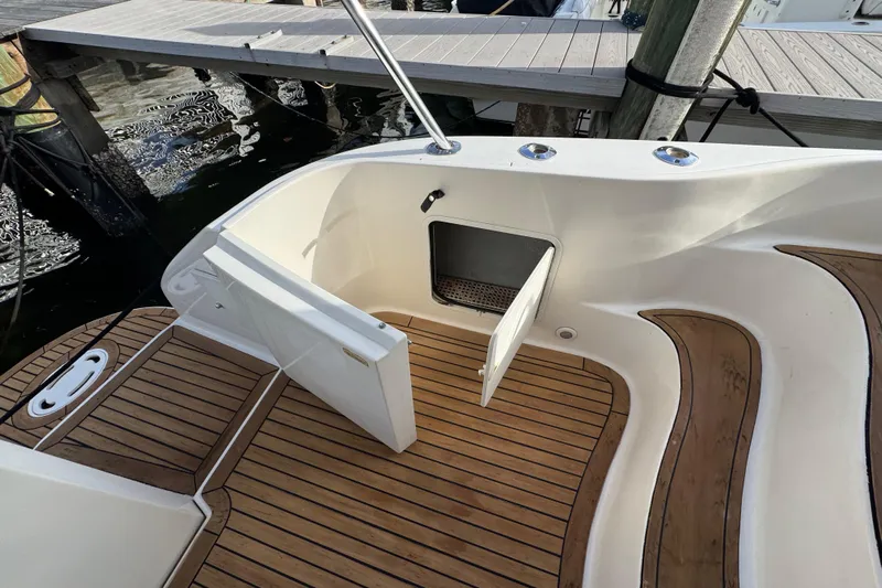 Scanner II Yacht Photos Pics 1998 Sea Ray 480 Sedan Bridge boat deck with open storage compartment.