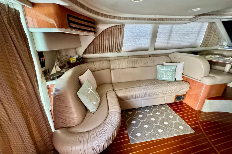 Scanner II Yacht Photos Pics Luxurious interior of a 1998 Sea Ray 480 Sedan Bridge with plush seating and elegant decor.