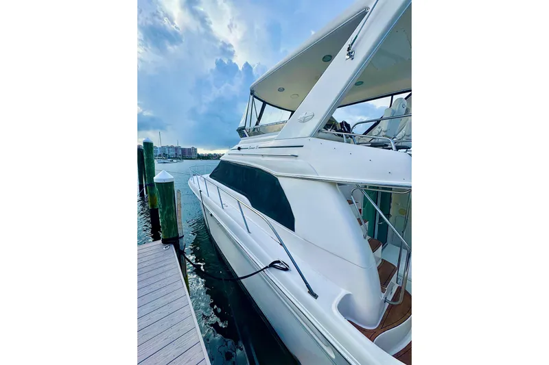 Scanner II Yacht Photos Pics 1998 Sea Ray 480 Sedan Bridge yacht docked, showcasing sleek design and spacious deck.