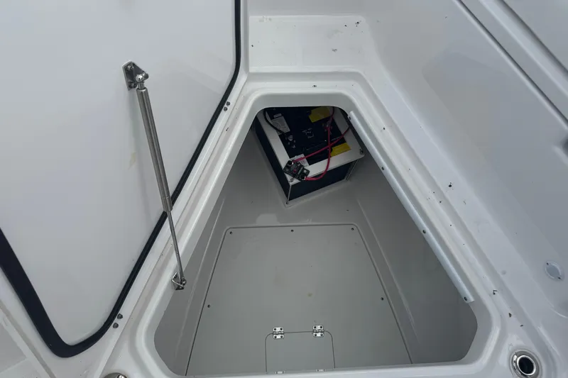  Yacht Photos Pics 2024 Blackfin 332 CC boat storage compartment with battery and wiring.