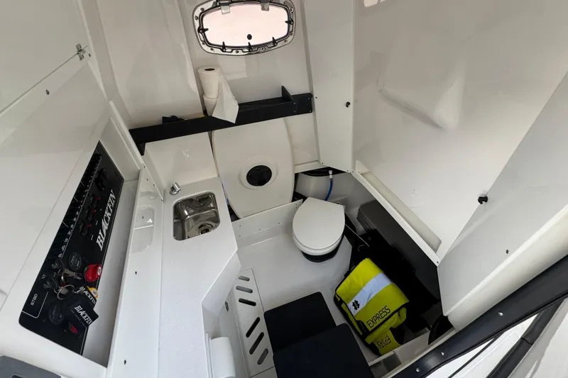  Yacht Photos Pics 2024 Blackfin 332 CC cabin interior with sink, toilet, and control panel.