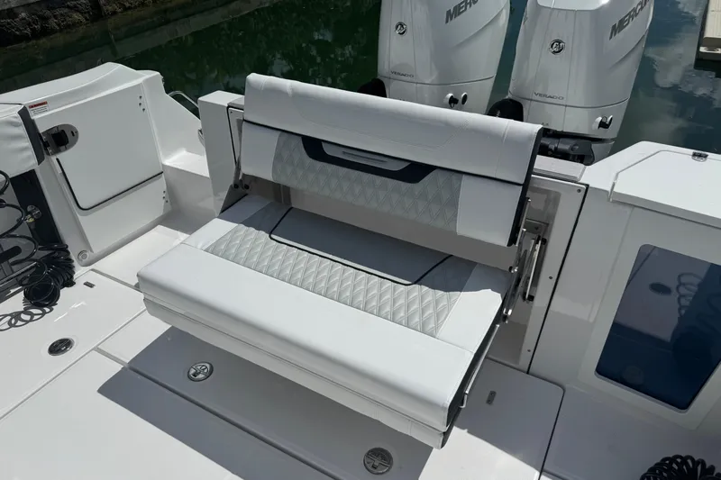  Yacht Photos Pics 2024 Blackfin 332 CC boat with foldable seating and dual Mercury engines.