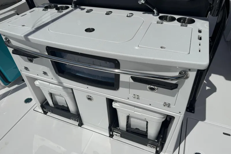  Yacht Photos Pics 2024 Blackfin 332 CC boat console with storage compartments and cup holders.