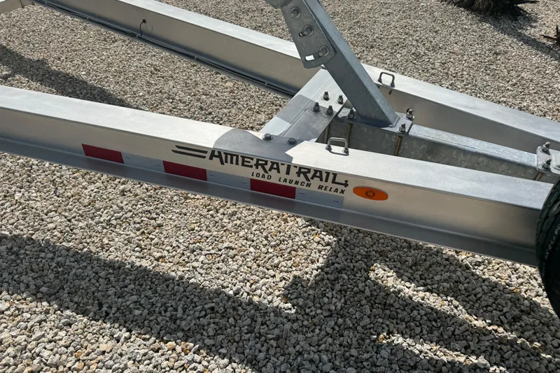  Yacht Photos Pics Trailer for 2024 Blackfin 332 CC boat on gravel surface.