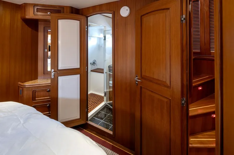 Forever Young Yacht Photos Pics Luxurious wooden interior of 2009 Selene 43 yacht cabin with ensuite bathroom.