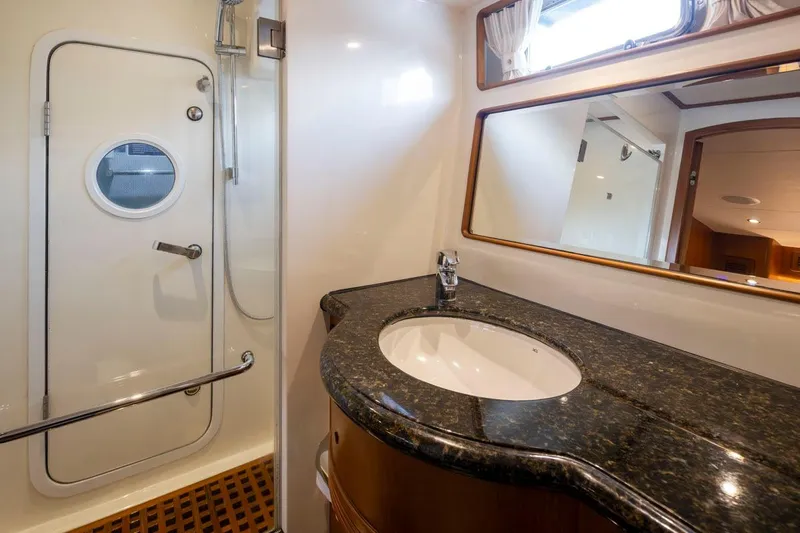 Forever Young Yacht Photos Pics Luxurious bathroom in 2009 Selene 43 yacht with granite countertop and shower.
