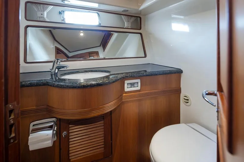 Forever Young Yacht Photos Pics Luxurious bathroom in 2009 Selene 43 yacht with wood accents and modern fixtures.