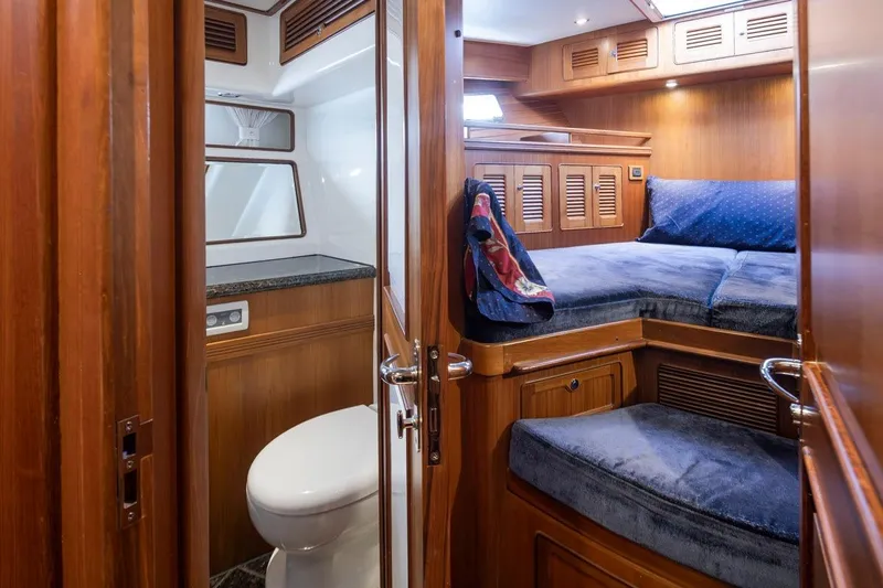 Forever Young Yacht Photos Pics Luxurious 2009 Selene 43 yacht interior with cozy cabin and modern bathroom.