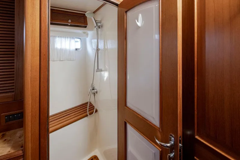 Forever Young Yacht Photos Pics Luxurious wooden shower interior on a 2009 Selene 43 yacht.