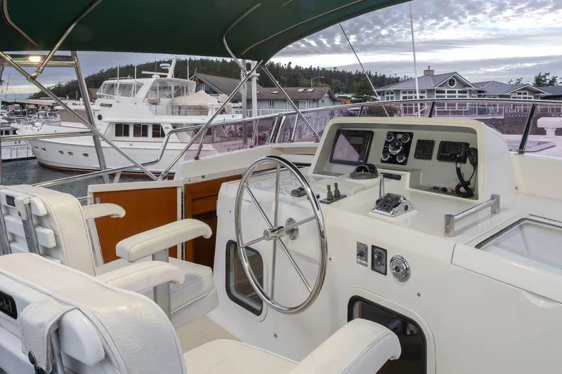Forever Young Yacht Photos Pics Cockpit of 2009 Selene 43 yacht with steering wheel and control panel.
