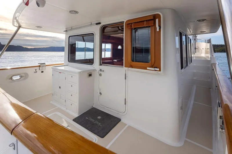 Forever Young Yacht Photos Pics 2009 Selene 43 yacht deck with wooden accents and ocean view.