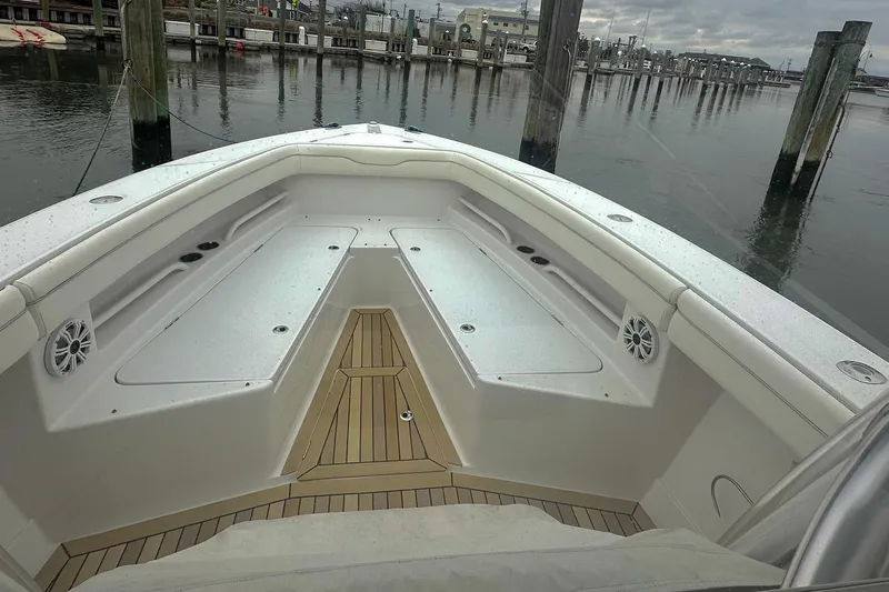 Warden Pass Too Yacht Photos Pics 2013 Jupiter 30 Center Console boat interior with seating and speakers at dock.