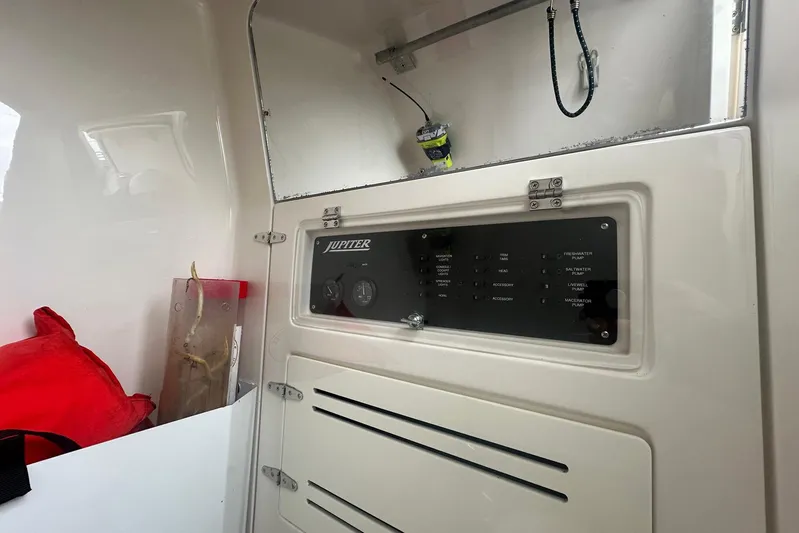 Warden Pass Too Yacht Photos Pics Control panel inside 2013 Jupiter 30 Center Console boat, featuring switches and storage.