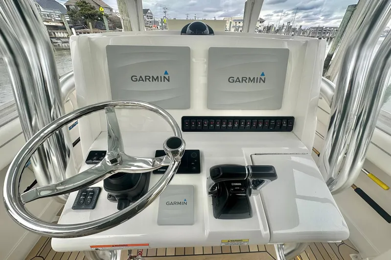 Warden Pass Too Yacht Photos Pics 2013 Jupiter 30 Center Console helm with Garmin displays and controls.